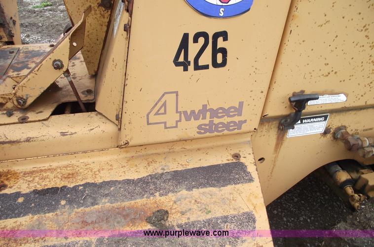 image for item 5437 Case 660 hoe and offset cable plow