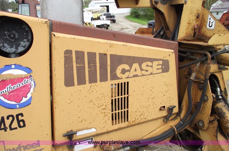 image for item 5437 Case 660 hoe and offset cable plow