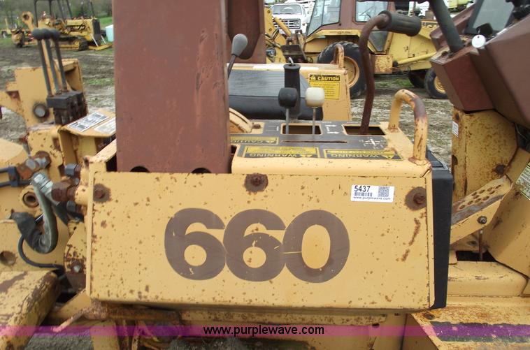 image for item 5437 Case 660 hoe and offset cable plow