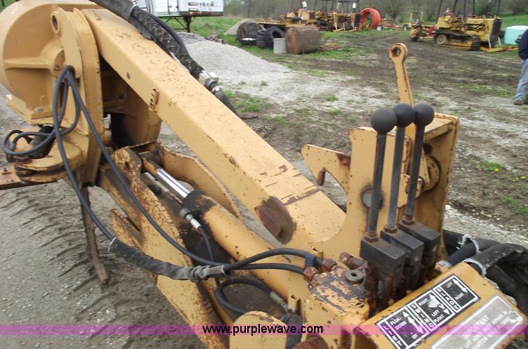 image for item 5437 Case 660 hoe and offset cable plow