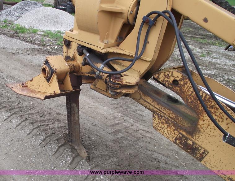 image for item 5437 Case 660 hoe and offset cable plow