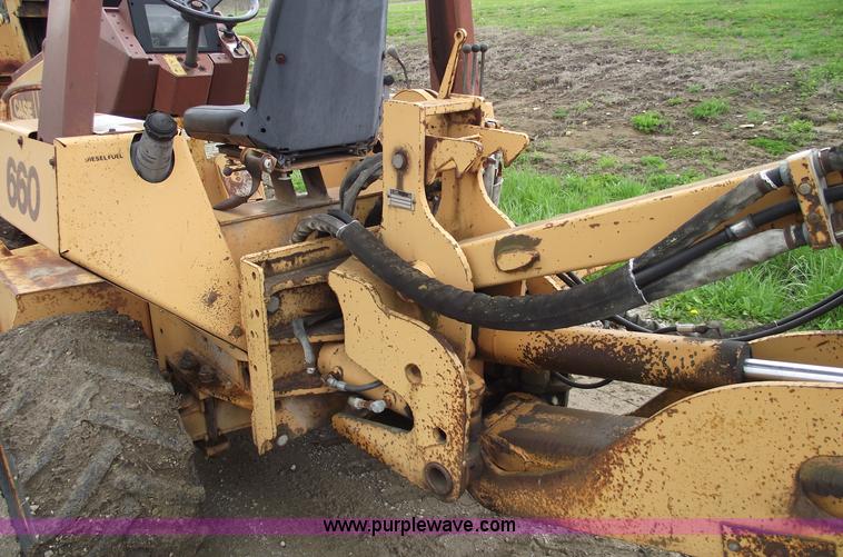 image for item 5437 Case 660 hoe and offset cable plow