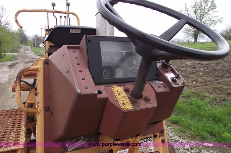 image for item 5437 Case 660 hoe and offset cable plow