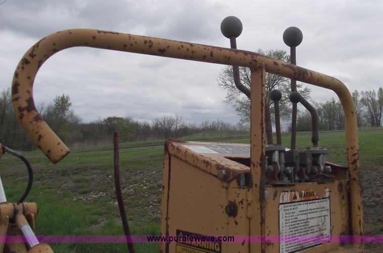 image for item 5437 Case 660 hoe and offset cable plow