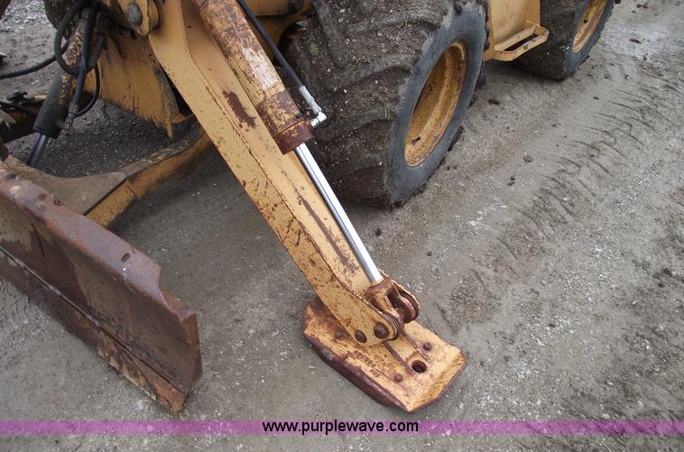 image for item 5437 Case 660 hoe and offset cable plow