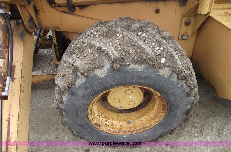 image for item 5437 Case 660 hoe and offset cable plow