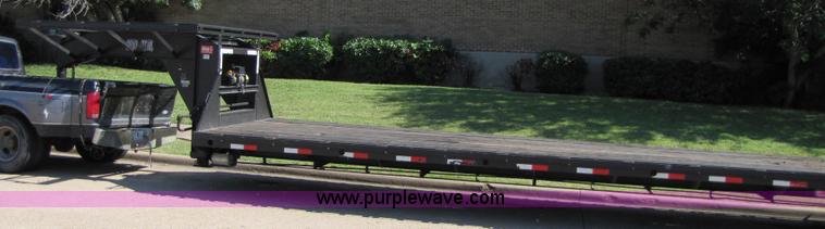 image for item 3457 2002 Load Trail 40' goose neck flatbed trailer