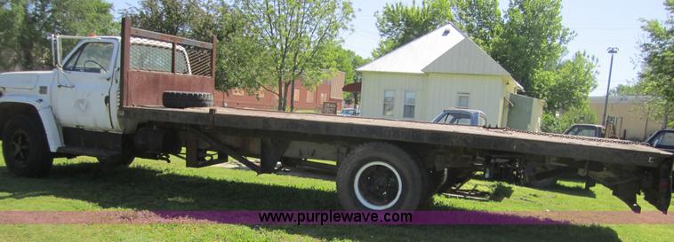 image for item 3693 1973 Chevrolet C65 flatbed rollback truck