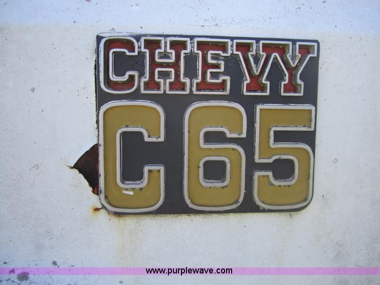 image for item 3693 1973 Chevrolet C65 flatbed rollback truck