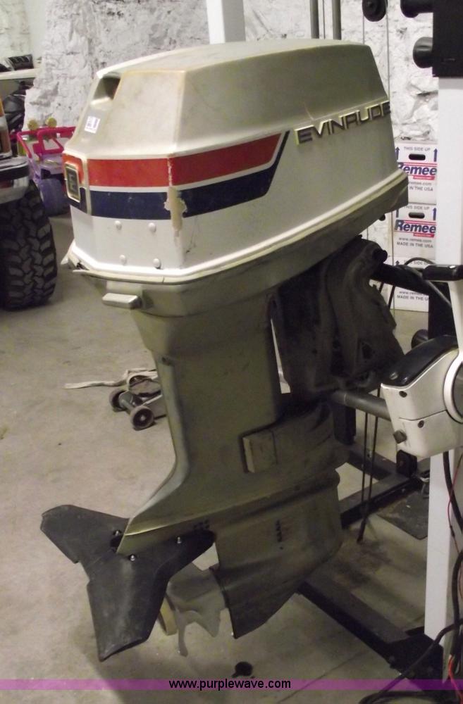 image for item 5530 1974 Evinrude outboard engine with controls