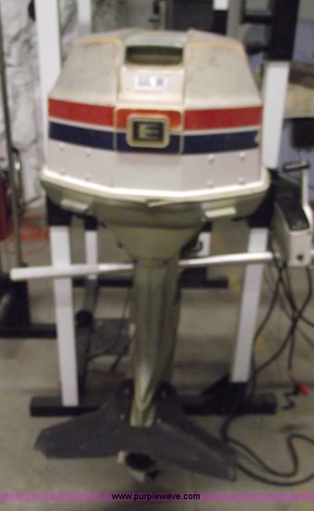 image for item 5530 1974 Evinrude outboard engine with controls