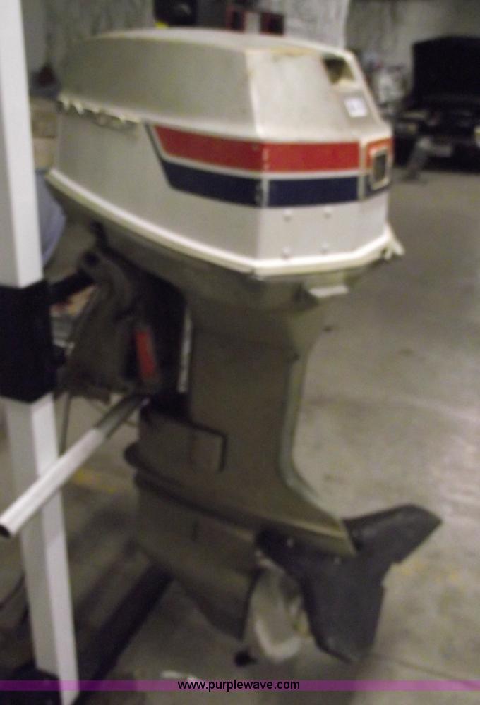 image for item 5530 1974 Evinrude outboard engine with controls