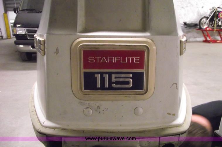 image for item 5530 1974 Evinrude outboard engine with controls