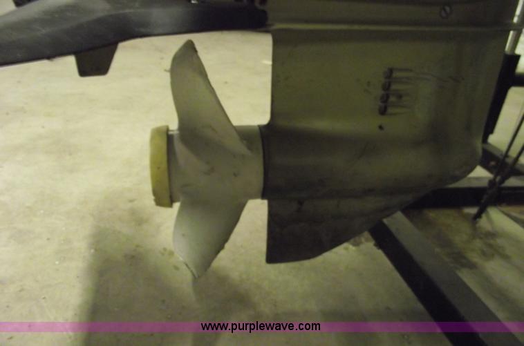 image for item 5530 1974 Evinrude outboard engine with controls