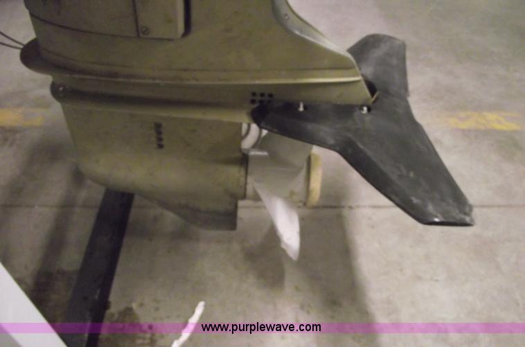 image for item 5530 1974 Evinrude outboard engine with controls