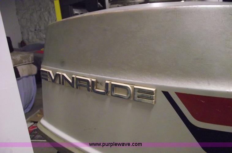image for item 5530 1974 Evinrude outboard engine with controls