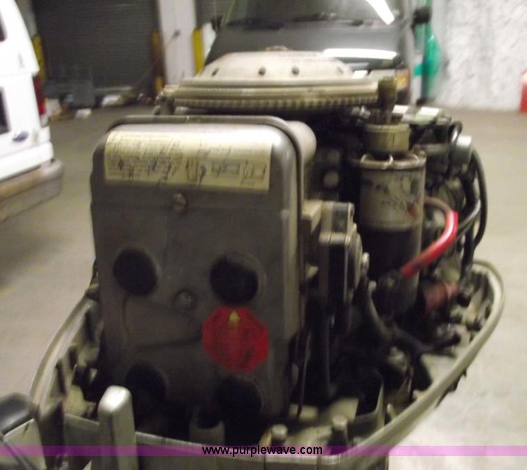 image for item 5530 1974 Evinrude outboard engine with controls