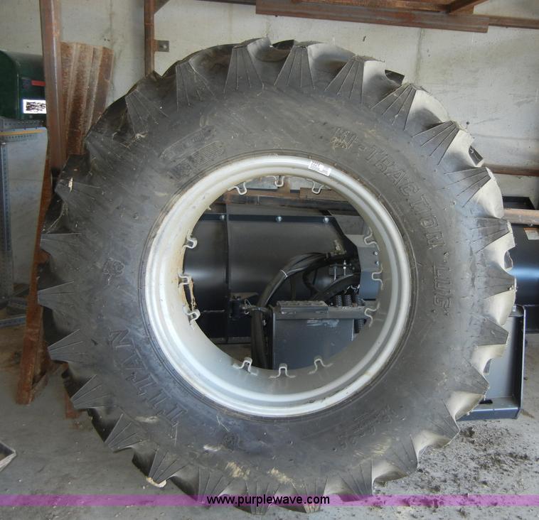 image for item 2224 New tractor tire and rim