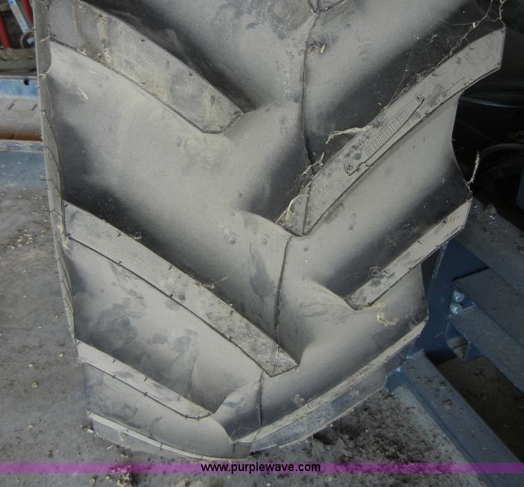 image for item 2224 New tractor tire and rim