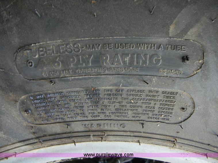 image for item 2224 New tractor tire and rim