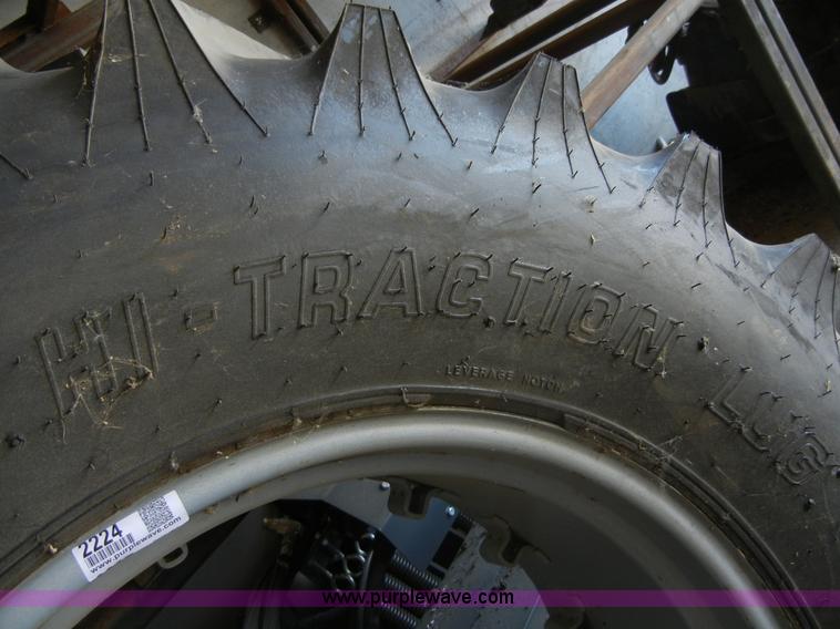 image for item 2224 New tractor tire and rim