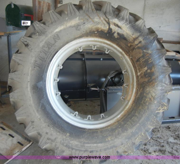 image for item 2224 New tractor tire and rim