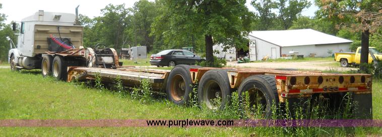 image for item 7872 1995 White GMC Aero WIA semi truck with triple axle trailer