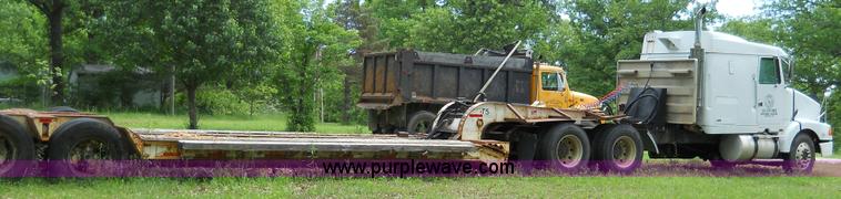 image for item 7872 1995 White GMC Aero WIA semi truck with triple axle trailer