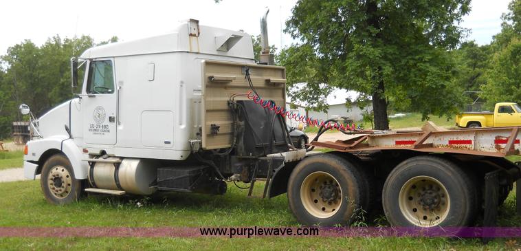 image for item 7872 1995 White GMC Aero WIA semi truck with triple axle trailer