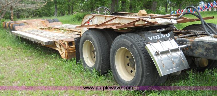 image for item 7872 1995 White GMC Aero WIA semi truck with triple axle trailer