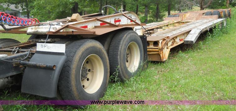 image for item 7872 1995 White GMC Aero WIA semi truck with triple axle trailer
