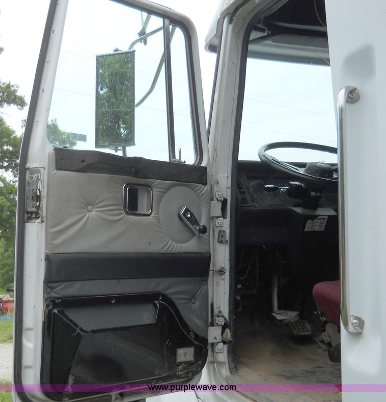 image for item 7872 1995 White GMC Aero WIA semi truck with triple axle trailer