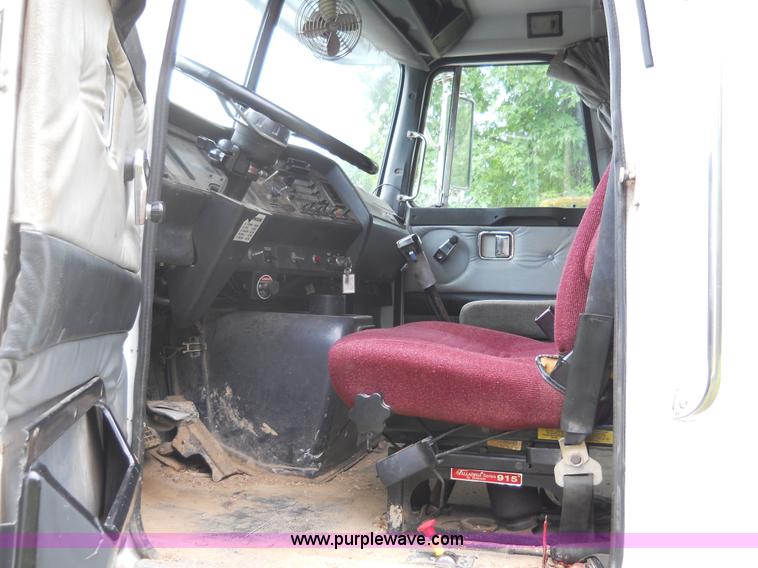 image for item 7872 1995 White GMC Aero WIA semi truck with triple axle trailer