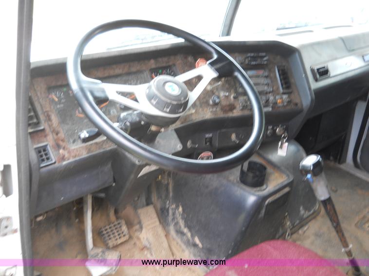 image for item 7872 1995 White GMC Aero WIA semi truck with triple axle trailer