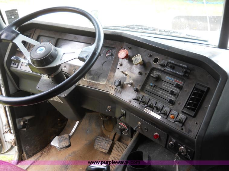 image for item 7872 1995 White GMC Aero WIA semi truck with triple axle trailer