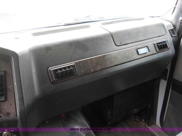 image for item 7872 1995 White GMC Aero WIA semi truck with triple axle trailer