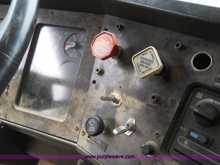 image for item 7872 1995 White GMC Aero WIA semi truck with triple axle trailer