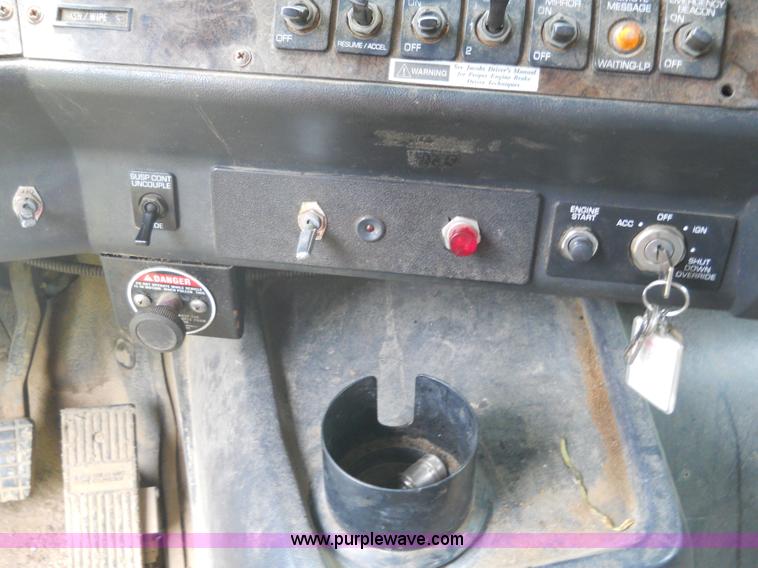 image for item 7872 1995 White GMC Aero WIA semi truck with triple axle trailer