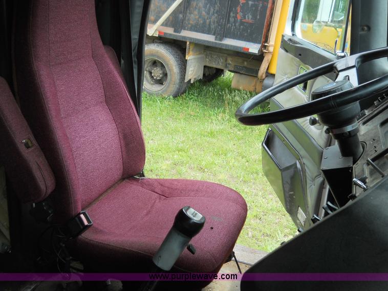 image for item 7872 1995 White GMC Aero WIA semi truck with triple axle trailer