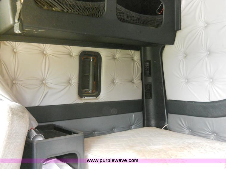 image for item 7872 1995 White GMC Aero WIA semi truck with triple axle trailer