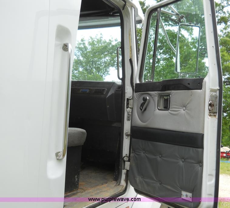 image for item 7872 1995 White GMC Aero WIA semi truck with triple axle trailer