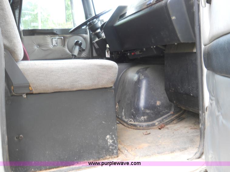 image for item 7872 1995 White GMC Aero WIA semi truck with triple axle trailer