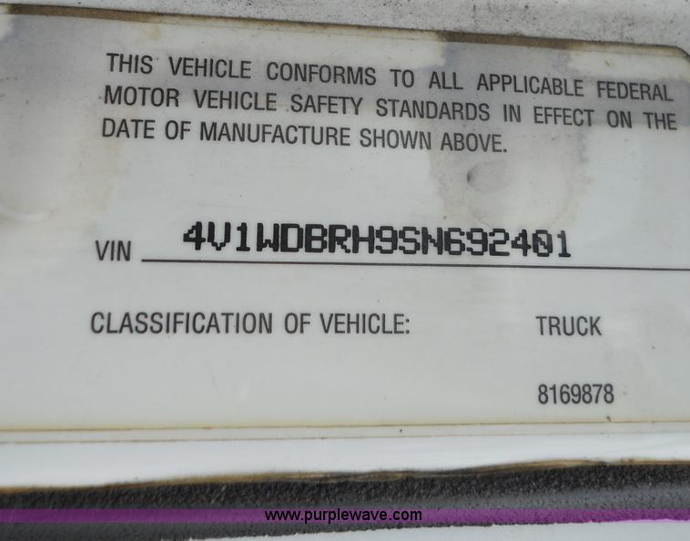 image for item 7872 1995 White GMC Aero WIA semi truck with triple axle trailer