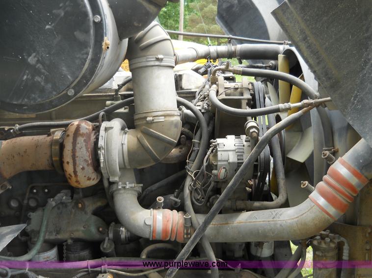 image for item 7872 1995 White GMC Aero WIA semi truck with triple axle trailer