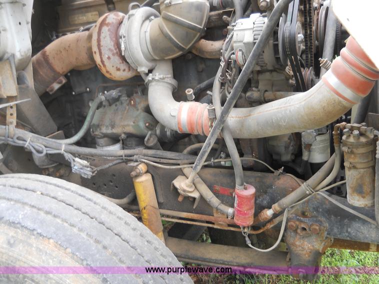 image for item 7872 1995 White GMC Aero WIA semi truck with triple axle trailer