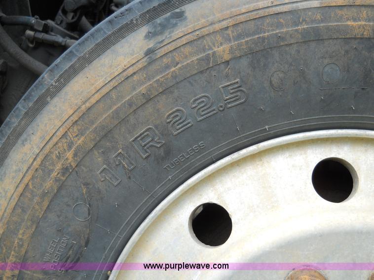 image for item 7872 1995 White GMC Aero WIA semi truck with triple axle trailer