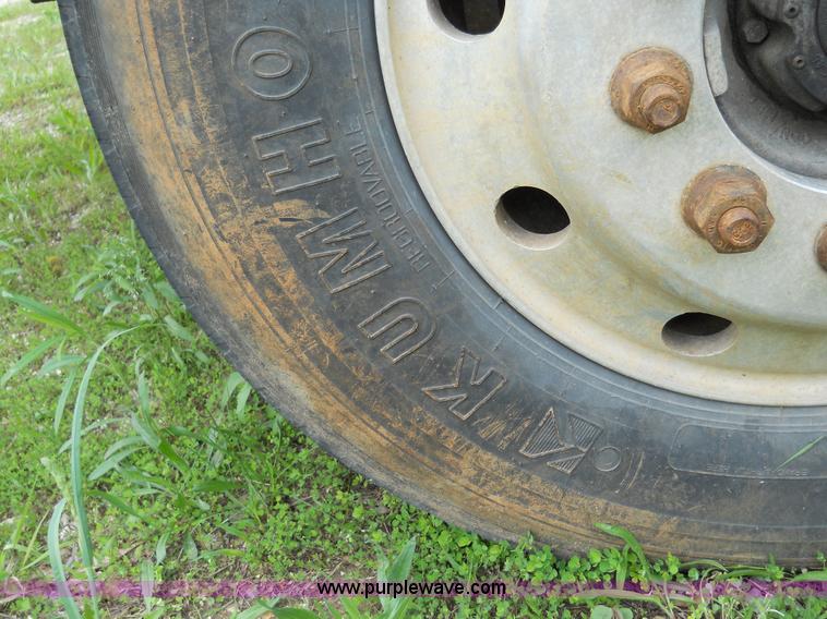 image for item 7872 1995 White GMC Aero WIA semi truck with triple axle trailer