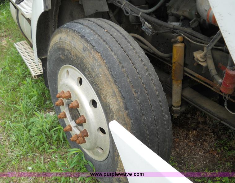 image for item 7872 1995 White GMC Aero WIA semi truck with triple axle trailer