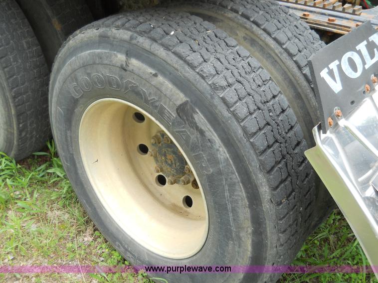 image for item 7872 1995 White GMC Aero WIA semi truck with triple axle trailer