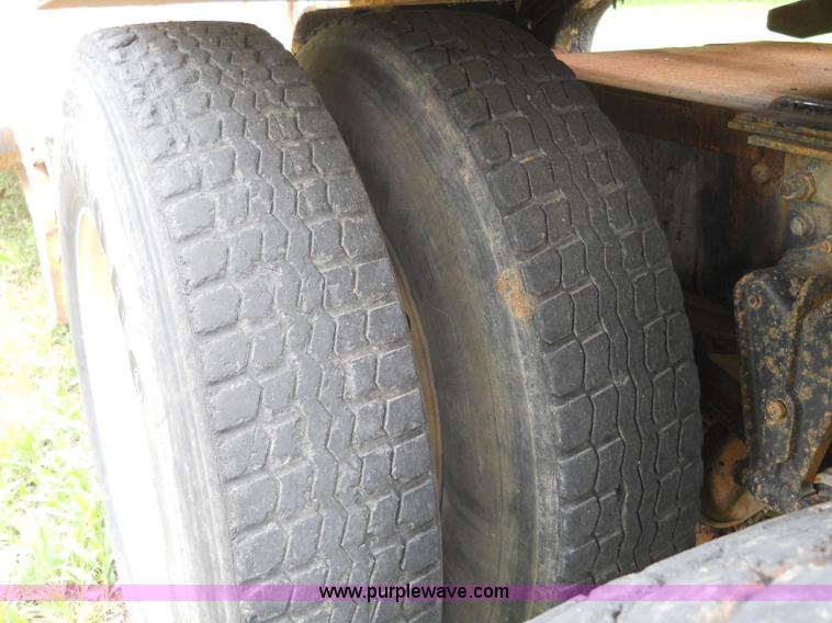 image for item 7872 1995 White GMC Aero WIA semi truck with triple axle trailer